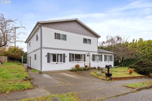 traditional home with aphalt driveway