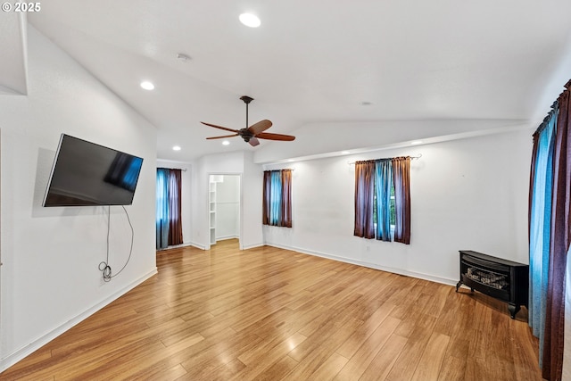 unfurnished living room featuring vaulted ceiling, recessed lighting, and light wood-style floors