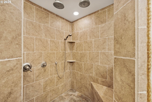 full bath with tiled shower