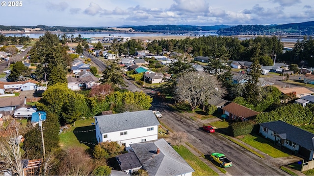 birds eye view of property featuring a residential view and a water view