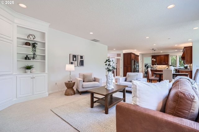 living area with recessed lighting, visible vents, light carpet, and built in features