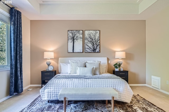 bedroom featuring carpet floors, baseboards, and visible vents