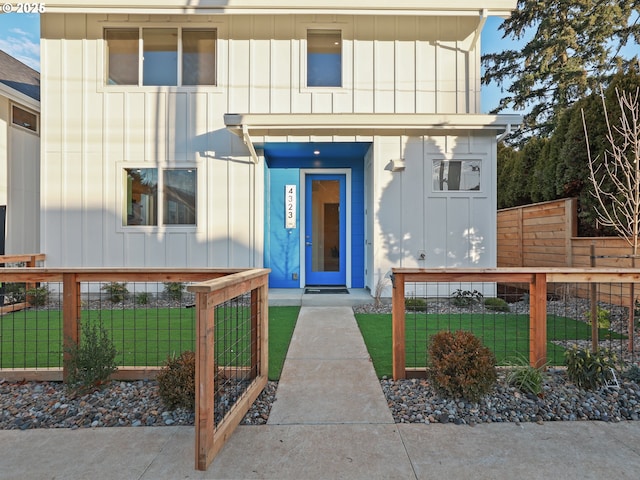 doorway to property featuring a lawn