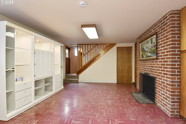 13275 NE Thompson Ct, Portland, OR 97230 - unfurnished living room featuring tile patterned floors, a brick fireplace, and stairs