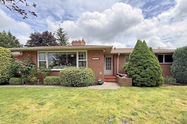 13275 NE Thompson Ct, Portland, OR 97230 - ranch-style house with brick siding, a front yard, and a chimney