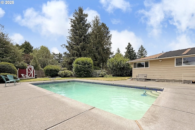 13275 NE Thompson Ct, Portland, OR 97230 - view of swimming pool featuring a patio, a shed, and a diving board