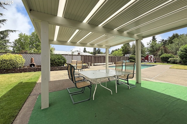 13275 NE Thompson Ct, Portland, OR 97230 - fenced backyard featuring a patio area and a storage unit