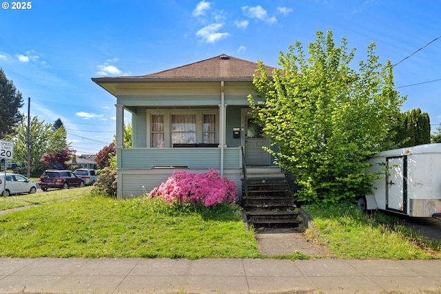 2104 N Rosa Parks Way, Portland, OR 97217 - view of front facade with a porch and roof with shingles
