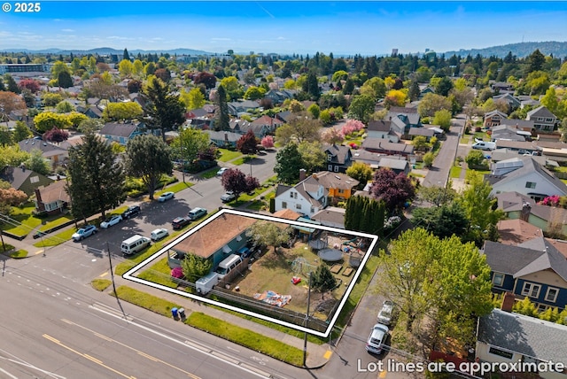 2104 N Rosa Parks Way, Portland, OR 97217 - aerial view of residential area with property parcel outlined and mountains