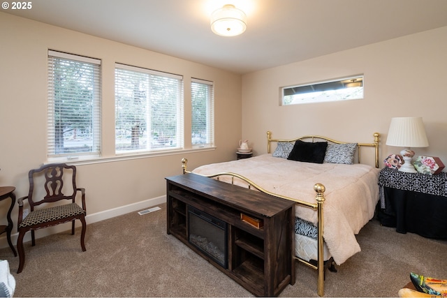 bedroom featuring carpet, visible vents, and baseboards