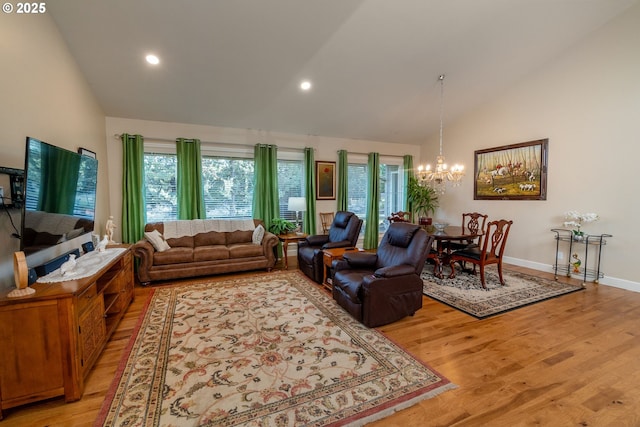 living room with baseboards, light wood-style flooring, high vaulted ceiling, and a notable chandelier