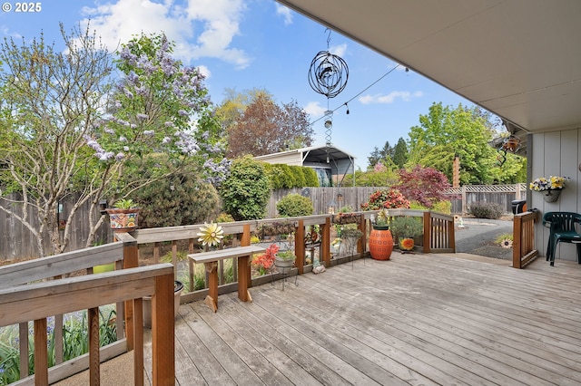 deck with a fenced backyard