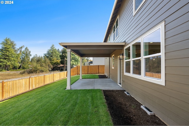 view of yard featuring a patio and fence