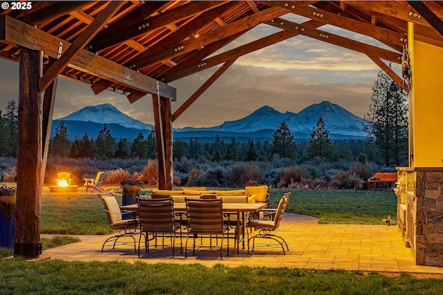 16830 Delicious St, Bend, OR 97703 - view of patio / terrace featuring a mountain view, a fire pit, and a wooded view