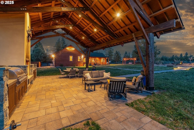 16830 Delicious St, Bend, OR 97703 - patio terrace at dusk with a gazebo, a patio area, and a yard
