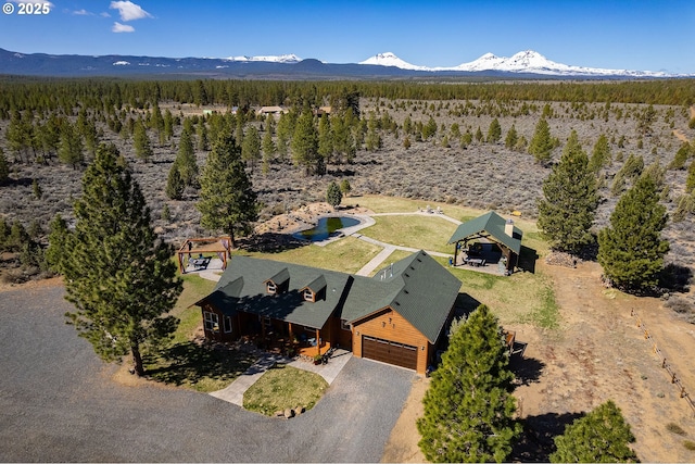 16830 Delicious St, Bend, OR 97703 - view of subject property with a mountain backdrop and a heavily wooded area