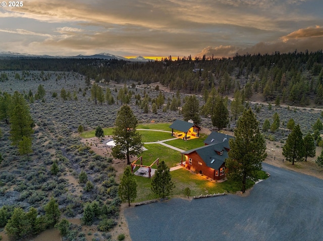 16830 Delicious St, Bend, OR 97703 - aerial view of property and surrounding area with a mountainous background and a heavily wooded area