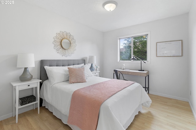 3038 SW Florida Ct Unit B, Portland, OR 97219 - bedroom featuring light wood-style flooring and baseboards