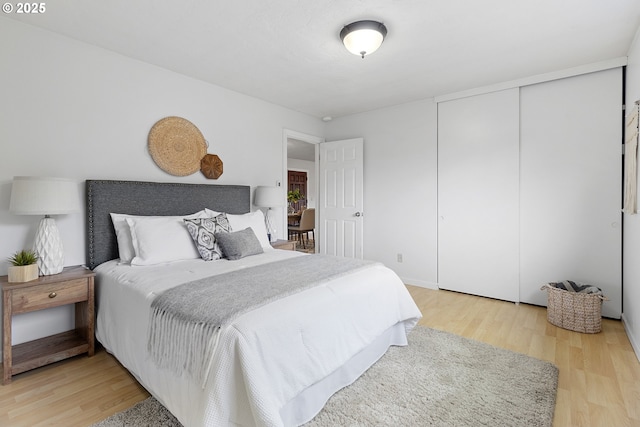 3038 SW Florida Ct Unit B, Portland, OR 97219 - bedroom featuring wood finished floors and a closet