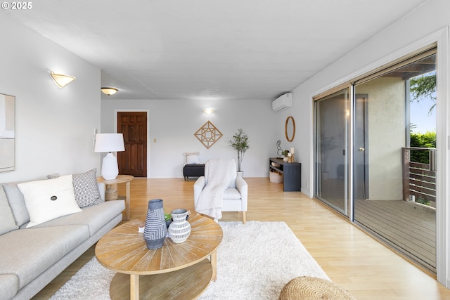 3038 SW Florida Ct Unit B, Portland, OR 97219 - living room featuring light wood-style flooring and a wall unit AC