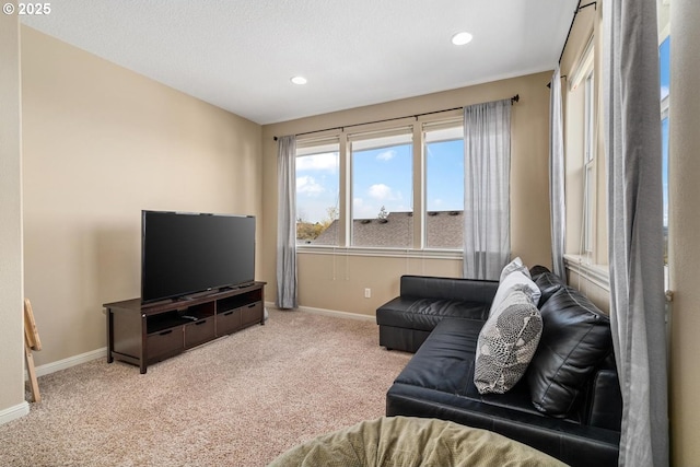 living room with carpet flooring, recessed lighting, and baseboards