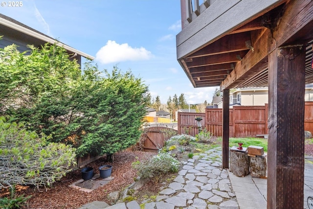 view of patio with a gate and fence