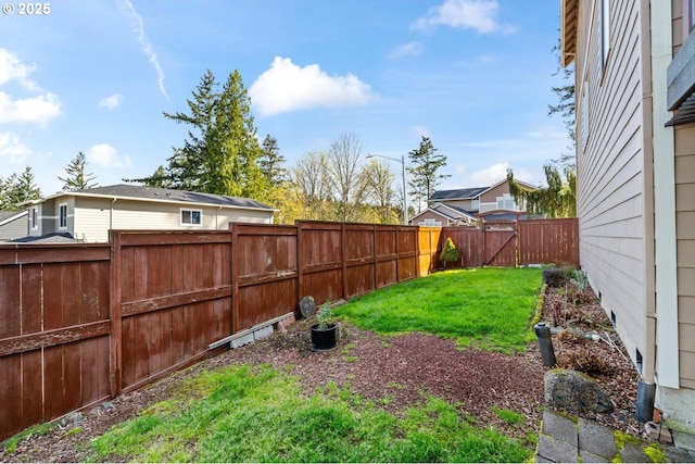 view of yard featuring a fenced backyard