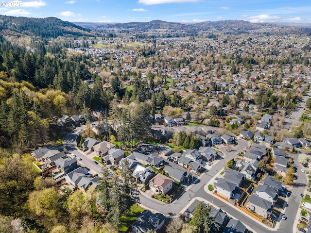 birds eye view of property with a mountain view and a residential view