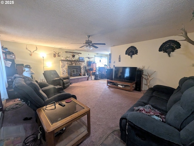 living room featuring ceiling fan, carpet, and a textured ceiling