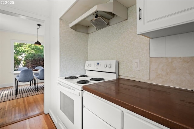 3726 NE 77th Ave, Portland, OR 97213 - kitchen featuring wood counters, white appliances, a sink, under cabinet range hood, and light wood finished floors