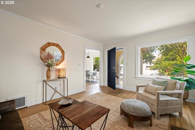 3726 NE 77th Ave, Portland, OR 97213 - living room featuring light wood finished floors, baseboards, ornamental molding, and a fireplace