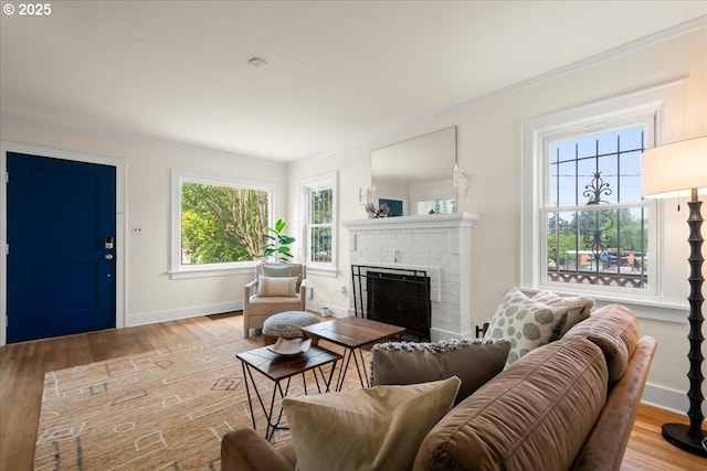 3726 NE 77th Ave, Portland, OR 97213 - living area with wood finished floors, crown molding, baseboards, and a brick fireplace