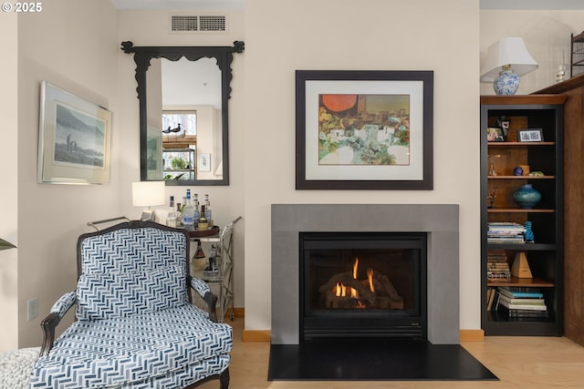 sitting room with light hardwood / wood-style floors