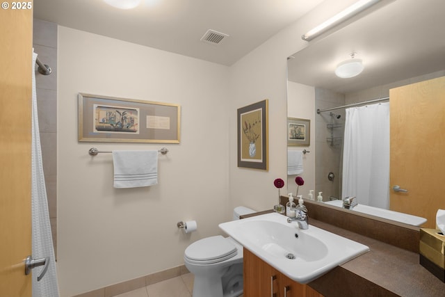 bathroom with tile patterned floors, vanity, a shower with shower curtain, and toilet