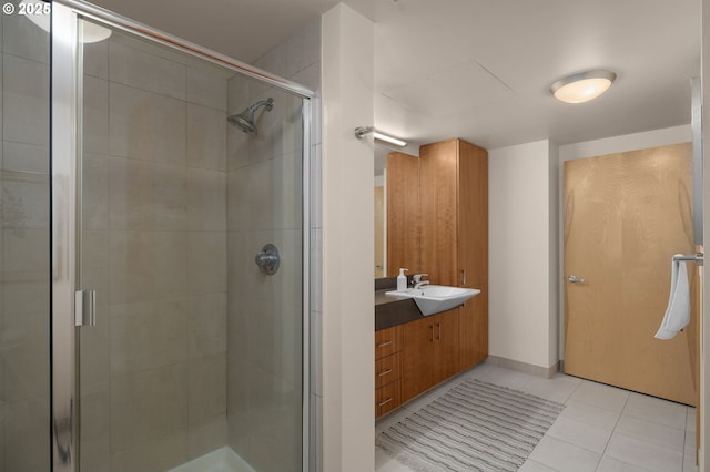 bathroom featuring tile patterned flooring, vanity, and an enclosed shower