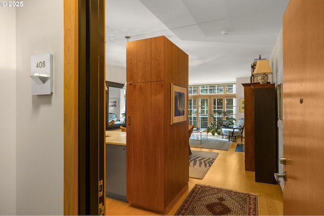 corridor featuring light hardwood / wood-style floors