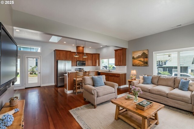 420 Bryant St, Clatskanie, OR 97016 - living room featuring dark wood-style flooring, baseboards, and recessed lighting