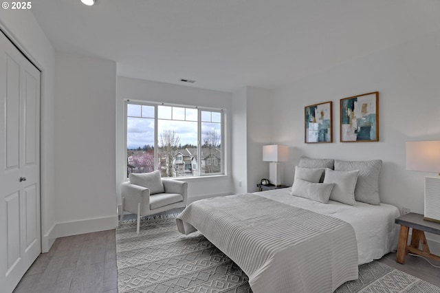 742 NW 118th Ave Unit 102, Portland, OR 97229 - bedroom with light wood-type flooring, a closet, and recessed lighting