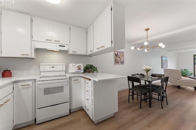 kitchen featuring a textured ceiling, light wood-type flooring, hanging light fixtures, white electric stove, and white cabinets