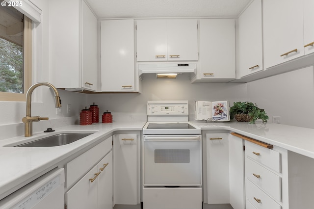 kitchen with sink, white cabinets, and white appliances