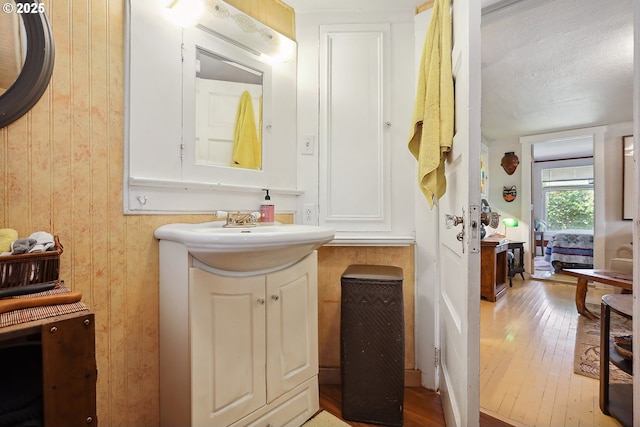 317 E 14th St, The Dalles, OR 97058 - bathroom featuring vanity and hardwood / wood-style floors