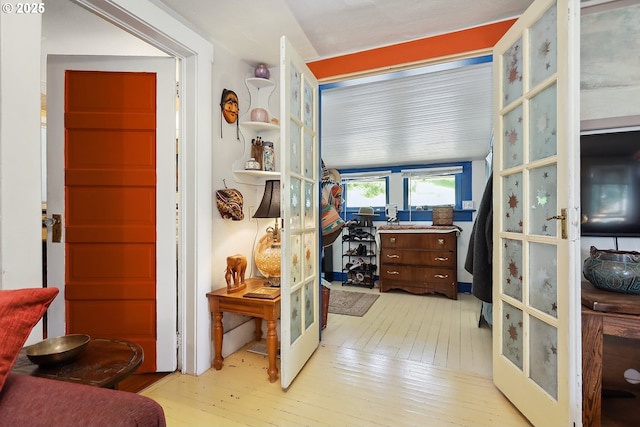 317 E 14th St, The Dalles, OR 97058 - corridor featuring hardwood / wood-style flooring and french doors