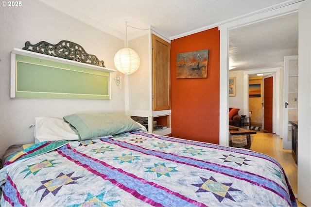 317 E 14th St, The Dalles, OR 97058 - bedroom featuring wood finished floors and ornamental molding