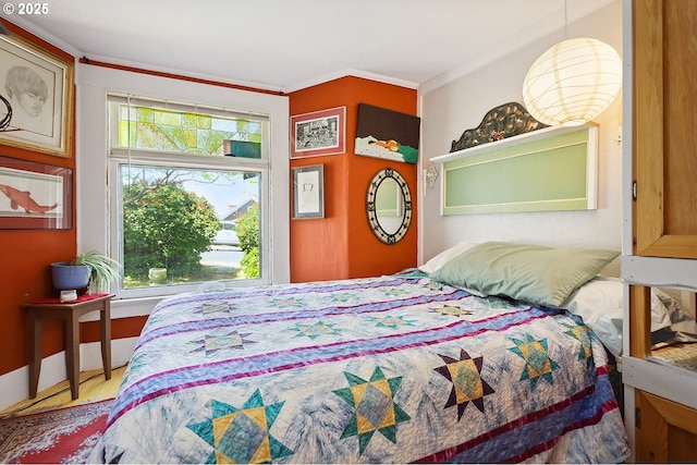 317 E 14th St, The Dalles, OR 97058 - bedroom featuring crown molding and wood finished floors