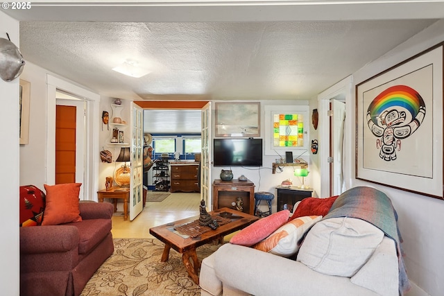 317 E 14th St, The Dalles, OR 97058 - living area with wood finished floors and a textured ceiling