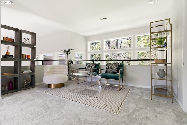 sitting room featuring visible vents and carpet flooring