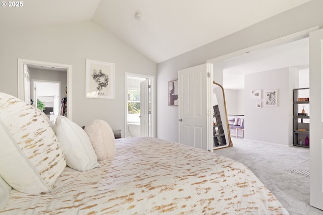 carpeted bedroom featuring vaulted ceiling