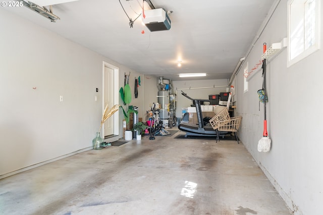 garage with secured water heater and a garage door opener