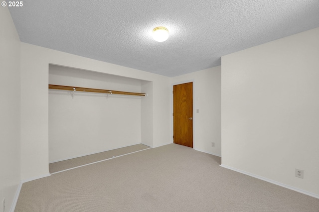 1308 Quaker St, Eugene, OR 97402 - unfurnished bedroom featuring a textured ceiling, carpet floors, and a closet