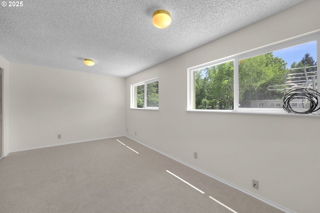 1308 Quaker St, Eugene, OR 97402 - carpeted empty room with a textured ceiling